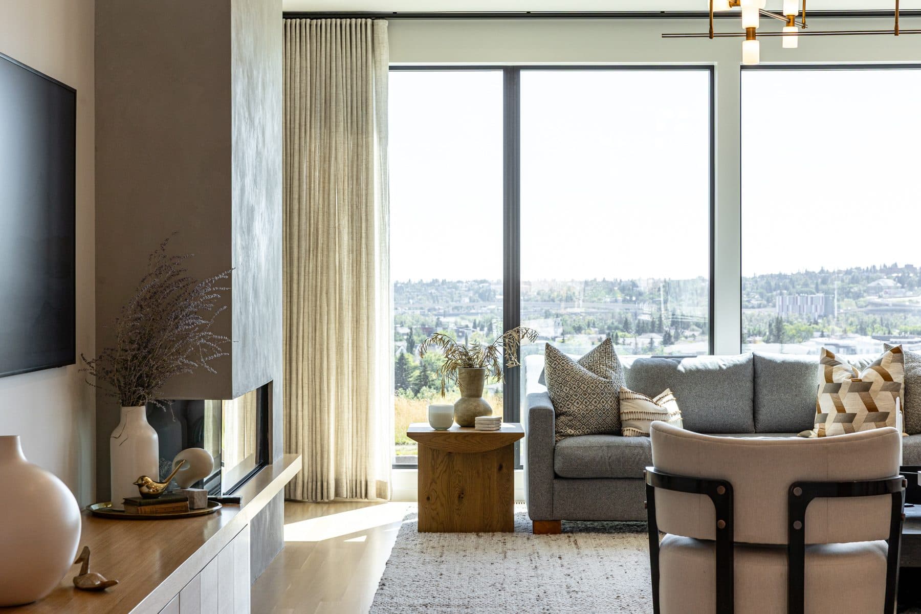 A main floor seen wide, living space running through to the dining table and kitchen beyond.