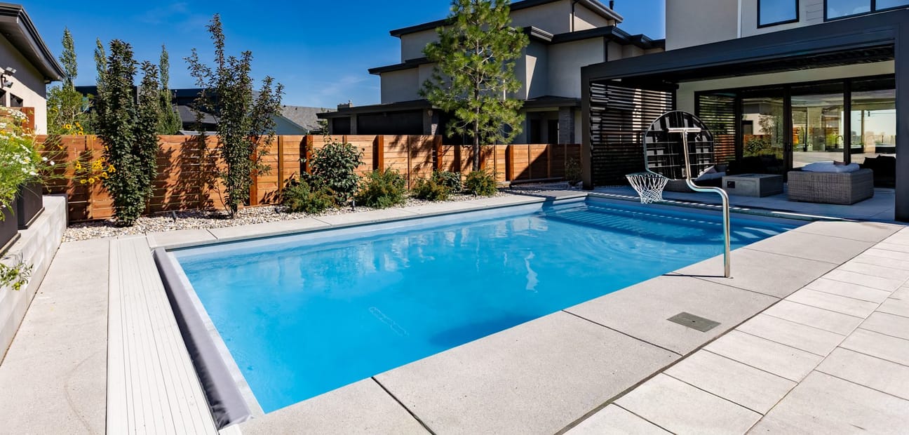 The rear elevation of a Riverside house, stepping down to the garden and pool terrace.